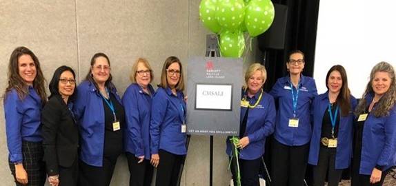 A group of people posing for the camera

Description automatically generated